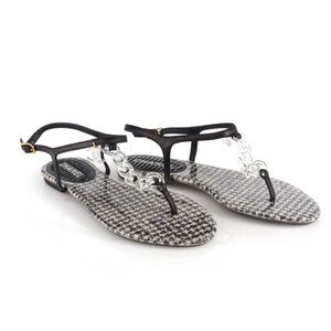 CHANEL | BLACK AND WHITE PVC AND LEATHER FLATS